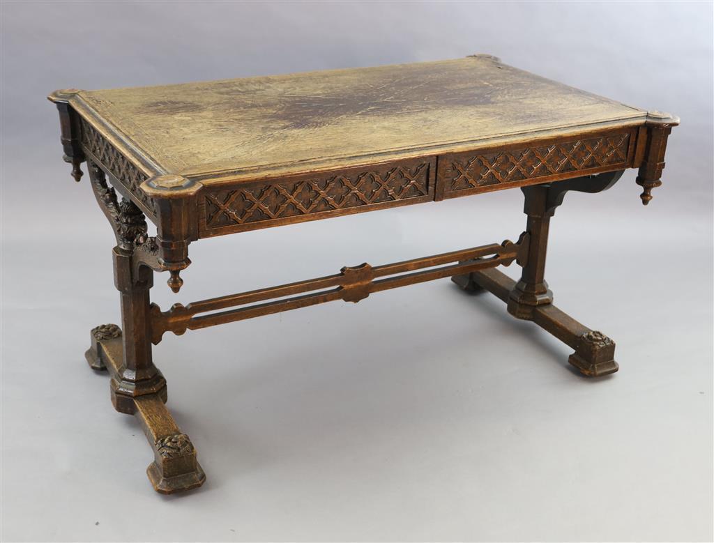 Attributed A.W.N. Pugin, A Victorian oak Gothic revival writing table, W.4ft 5.5in D.2ft 9.5in. H.2ft 6in.